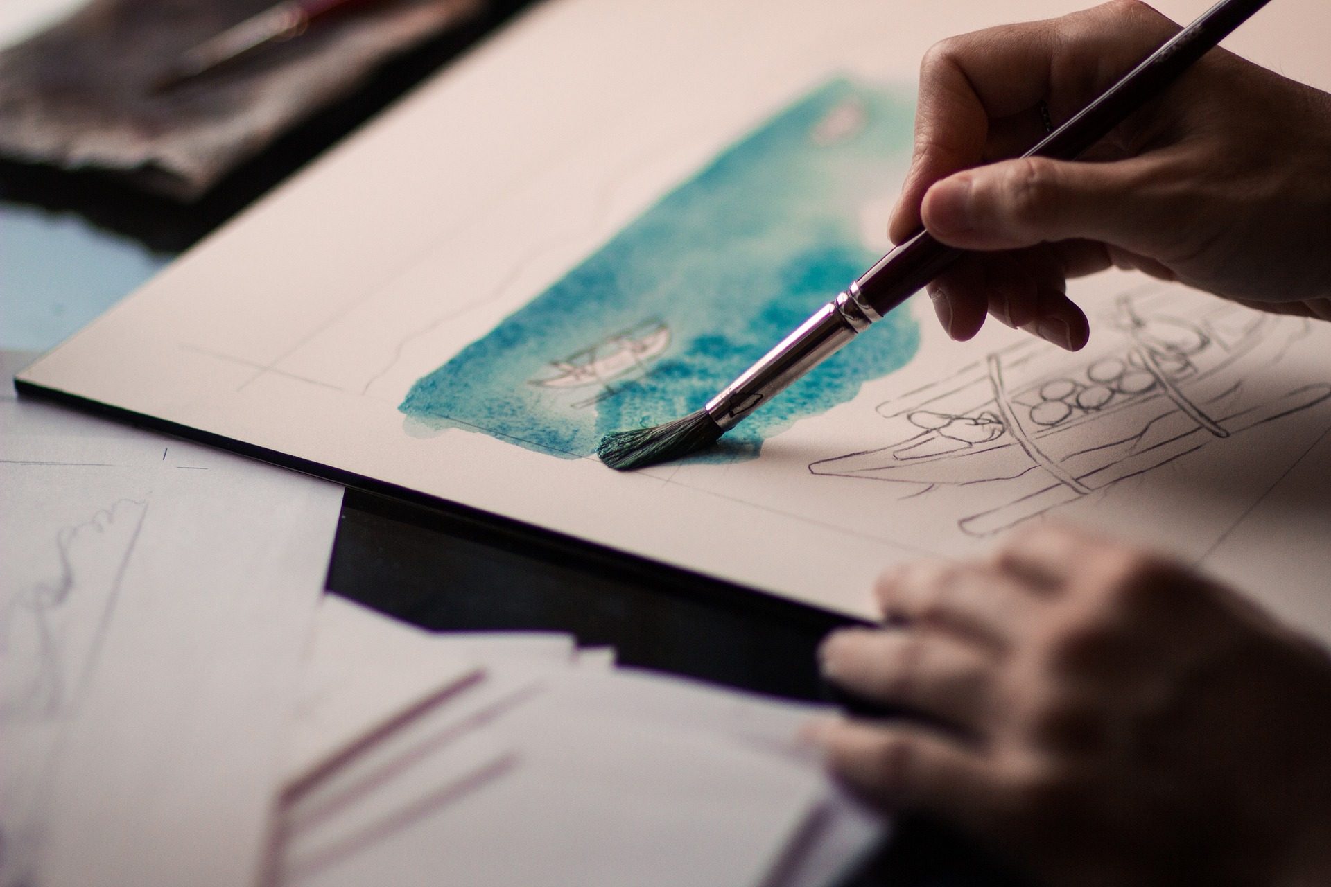 A pair of hands skillfully crafting a piece of art, symbolizing creativity and hidden talents.